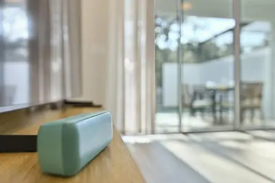 a television sitting on top of a wooden table at Oasis NEW Townhome Splash Pool Nature-Infused in Orlando