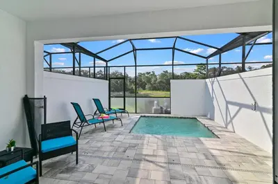 a swimming pool in a house with a glass roof at Discover Your Escape - NEW house wPrivate Pool in Orlando