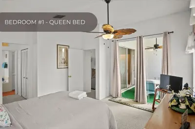 a bedroom with a bed and a ceiling fan at Cozy 3BR Family Home Minutes from Disney in Kissimmee