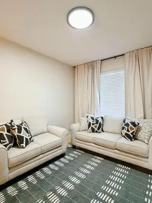 a living room with two couches and a window at 7 Bd/ 5.5 Ba- Terra Verde Resort -Near Disney in Kissimmee