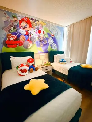a bedroom with two beds and a mario brothers mural at 7 Bd/ 5.5 Ba- Terra Verde Resort -Near Disney in Kissimmee
