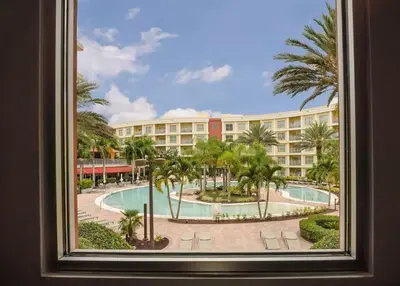 a view of a resort from a window at Apto 2Q no Meliá Celebration | Perto da Disney in Orlando