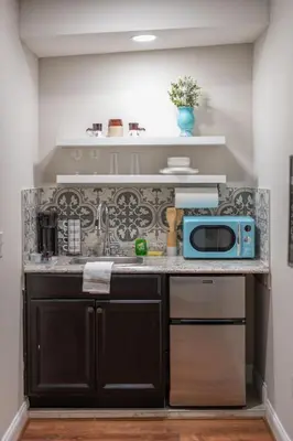 a kitchen with a counter with a microwave on it at Studio in the heart of Orlando in Orlando