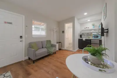 a living room with a couch and a table at Studio in the heart of Orlando in Orlando