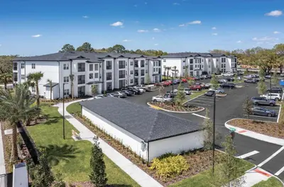 an aerial view of a parking lot at a apartment complex at Landing Incredible 1BD Clubhouse Gym in Orlando