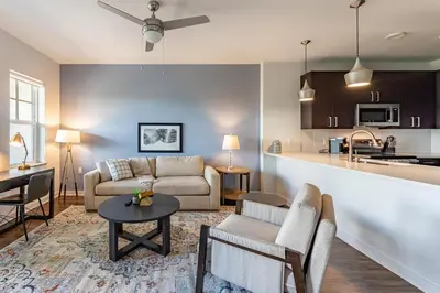 a living room with a couch and a table at Landing Beautiful 2BD in Kissimmee in Kissimmee