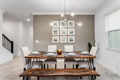 a dining room with a table and chairs at 5BR/5BA Home & Storey Lake Water Park Amenities in Kissimmee
