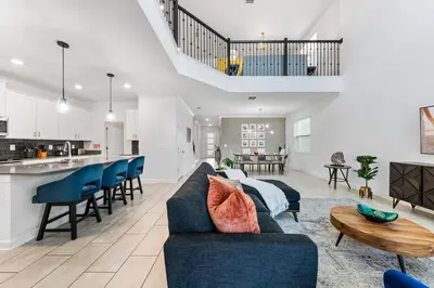 a living room with a couch and a table at 5BR/5BA Home & Storey Lake Water Park Amenities in Kissimmee