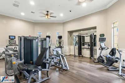 a gym with treadmills and exercise machines at The Epic 11 Vista Cay Resort Orlando Florida in Orlando