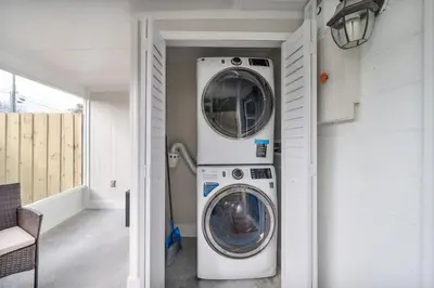 a laundry room with a washer and dryer in a house at Pet Friendly Studio Unit Near Downtown and Parks - 20 mi to Disney in Saint Cloud