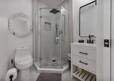 a bathroom with a shower and a toilet and a sink at Pet Friendly Studio Unit Near Downtown and Parks - 20 mi to Disney in Saint Cloud