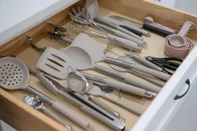 a drawer full of kitchen utensils in a drawer at Pet Friendly Studio Unit Near Downtown and Parks - 20 mi to Disney in Saint Cloud