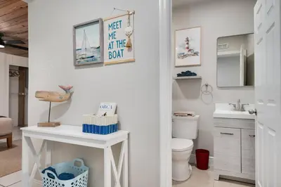 a bathroom with a toilet and a sink at Hip Orlando Studio Nearby Restaurants and Parks in Orlando