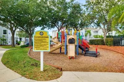 a playground with a slide in a park at Resort Perks! Family Home 4 Mi to Disney World in Kissimmee