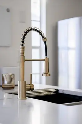 a kitchen sink with a faucet on a counter at Bright Ground Floor Condo Minutes to Parks in Kissimmee