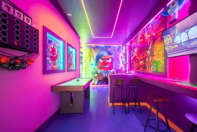 a room with a bar with pink lights and stools at 2026 NEW Home 8 Bedrooms At Bella Vida in Kissimmee