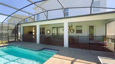 a house with a swimming pool in front of it at 4573TB-New Listing- 10bed/5 bath-Private Pool in Kissimmee