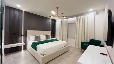a bedroom with a white bed and a chair at 6277SK-New Brand-12bed/11.5bath-Private Pool&SPA in Orlando