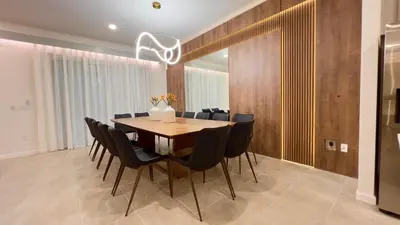 a dining room with a wooden table and black chairs at 6277SK-New Brand-12bed/11.5bath-Private Pool&SPA in Orlando