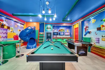 a pool table in a childrens play room with a pool table at Brand NEW Home 09 BedroomsPoolGame Room in Kissimmee