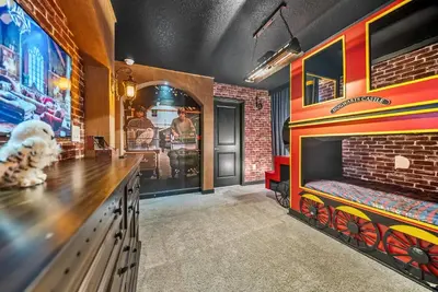 a dining room with a bar and a brick wall at Brand NEW Home 09 BedroomsPoolGame Room in Kissimmee