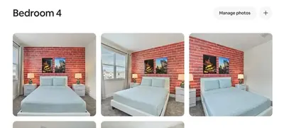a bedroom with two beds and a brick wall at New townhouse in Clermont -Orlando area in Orlando