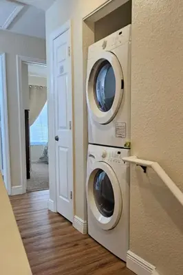a laundry room with a washer and dryer at True Fantasies 101 in Kissimmee