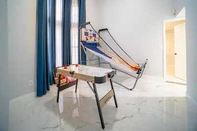 a hammock and a table in a room at Spacious Orlando Getaway Vacation Home in Orlando