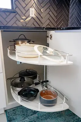 a shelf with pots and pans in a kitchen at Spacious Orlando Getaway Vacation Home in Orlando