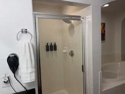 a bathroom with a shower with a glass door at Magical Condo 3 bedroom in Orlando