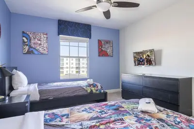 a bedroom with two beds and a ceiling fan at Townhome 4Q c/ Piscina Privativa – Storey Lake in Kissimmee