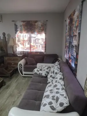 a living room with a large couch at A great environment living space in Orlando