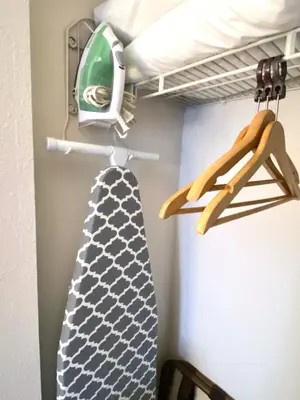 a tie hanging on a rack in a closet at Sea World Orlando Apts Parks Convention Centre in Orlando