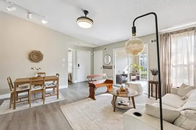 a living room with a couch and a table at Quiet Gated Condo Near Universal with Pool and View in Orlando