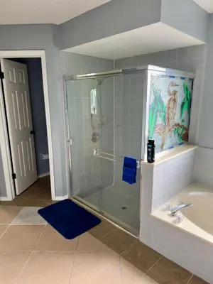 a bathroom with a shower and a sink at Magic getaway in Kissimmee