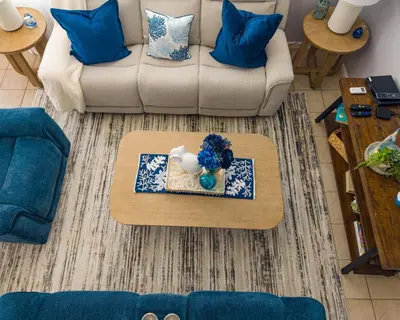 a living room with a coffee table and a couch at Magic Palms House 10 Min to Parks in Kissimmee