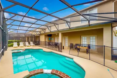 an indoor swimming pool with a glass roof at 8033 Acadia Estates Court in Orlando