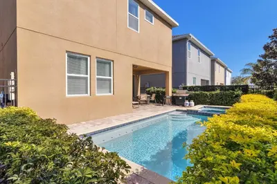 a swimming pool in front of a house at 480 Lasso Dr. · 480 Villa - Large Luxury 7BD Home - SpaPool in Orlando