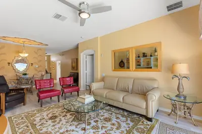 a living room with a couch and a table at 2232 Wyndham Palms Way in Kissimmee