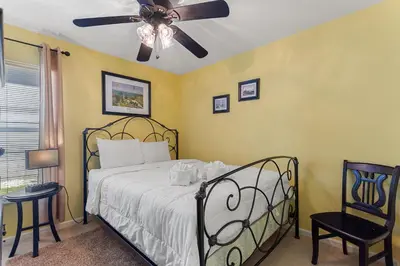 a bedroom with a bed and a ceiling fan at 2232 Wyndham Palms Way in Kissimmee