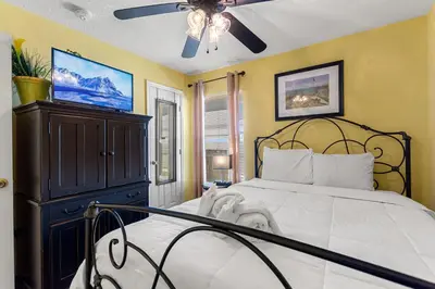 a bedroom with a large bed and a ceiling fan at 2232 Wyndham Palms Way in Kissimmee