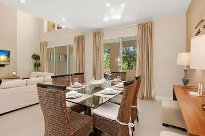 a dining room with a table and chairs at Two Story Resort Retreat Near Theme Parks in Orlando
