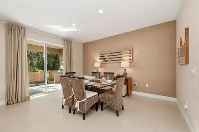 a dining room with a table and chairs at Two Story Resort Retreat Near Theme Parks in Orlando