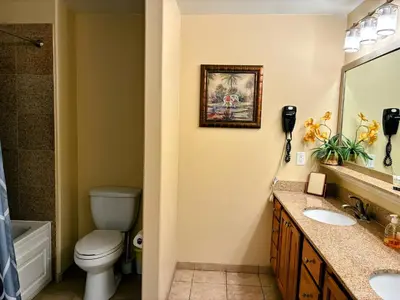 a bathroom with a toilet and a sink at Blue Heron Beach Resort Tower 12 FL 1204 Fully Furnished in Orlando