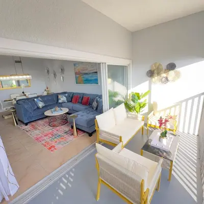 a living room with a blue couch and chairs at Your Epic Disney Getaway Spacious Home 3BD 3BA in Orlando