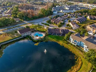 an aerial view of a house with a swimming pool at Mango Keys Getaway Near Theme Parks in Kissimmee