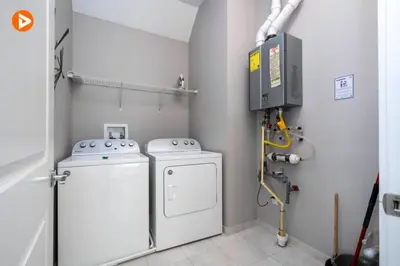a laundry room with a washer and dryer at Perfect Home 5 Minutes from Disney 5BD 15P in Orlando