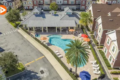 an aerial view of a pool at a resort at (7556) 3-Bedroom House in Resort near Disney in Orlando