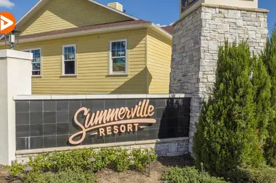 a yellow house with a sign for a summerville resort at (7556) 3-Bedroom House in Resort near Disney in Orlando