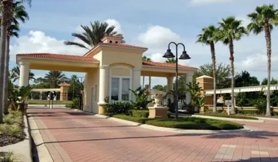 a home with a gazebo and palm trees at Sun Key Getaway in Kissimmee